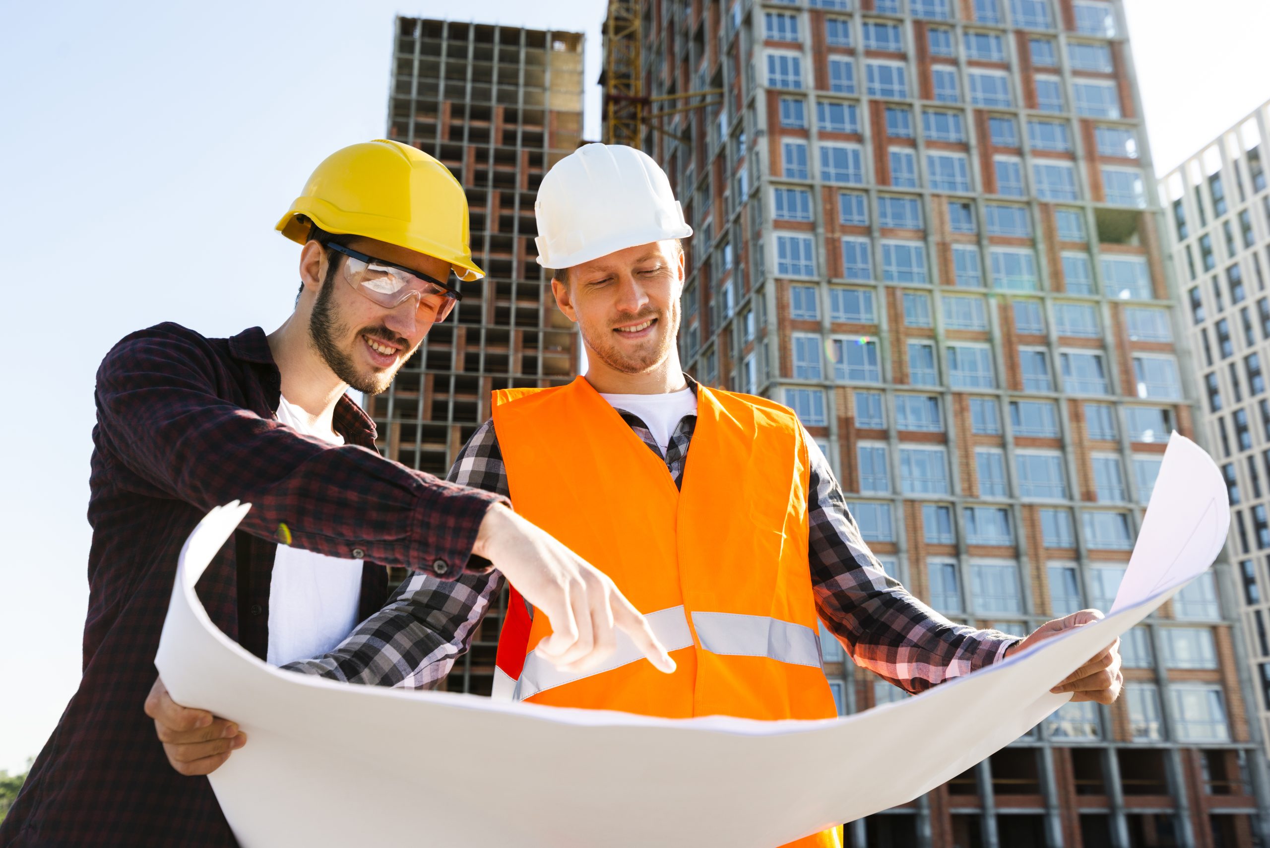 medium shot low angle view engineer architect supervising construction